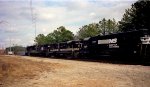 A diverse train of locomotives heads northbound